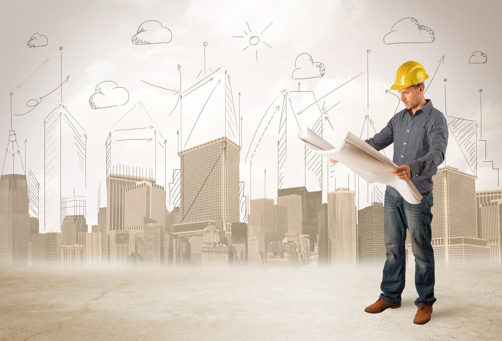 Business engineer planing at construction site with city background concept