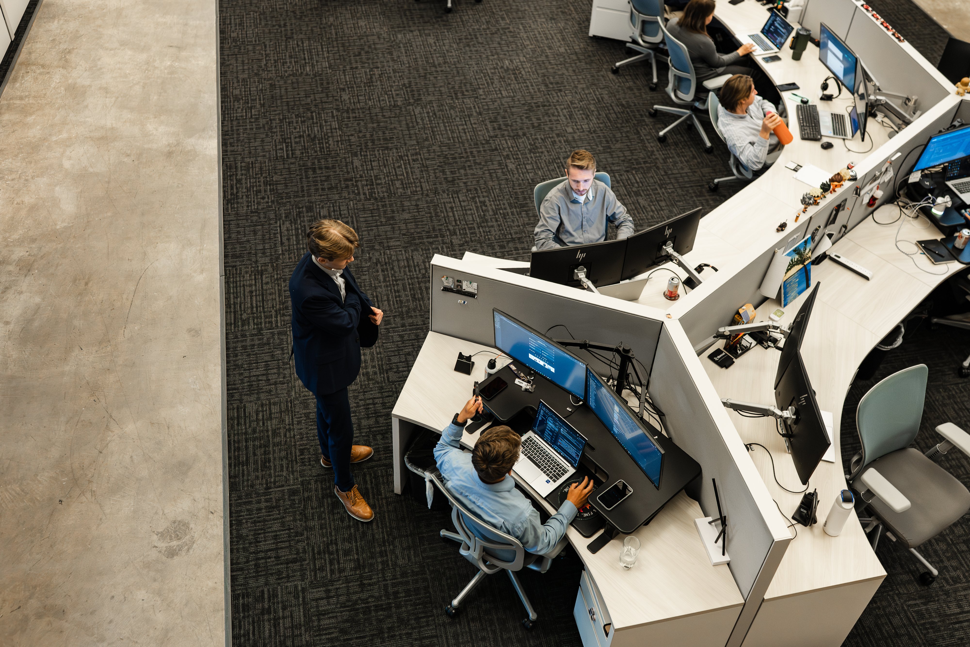 Lazorpoint team discussing IT leadership in the office.